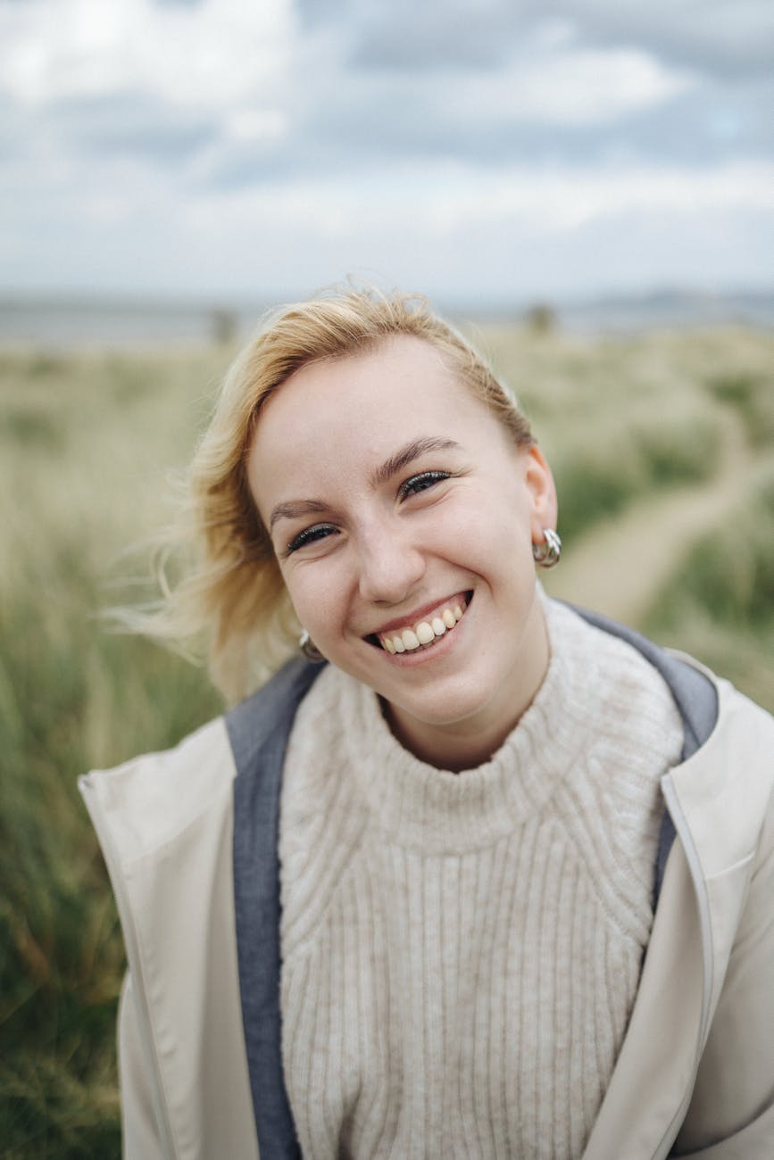 portrait of blonde woman by the shore