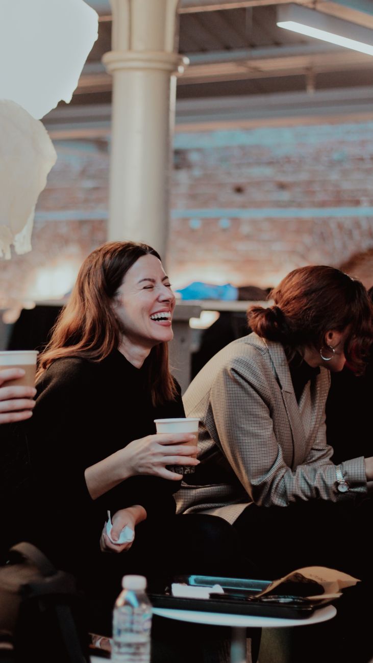 candid laughter at a casual indoor gathering